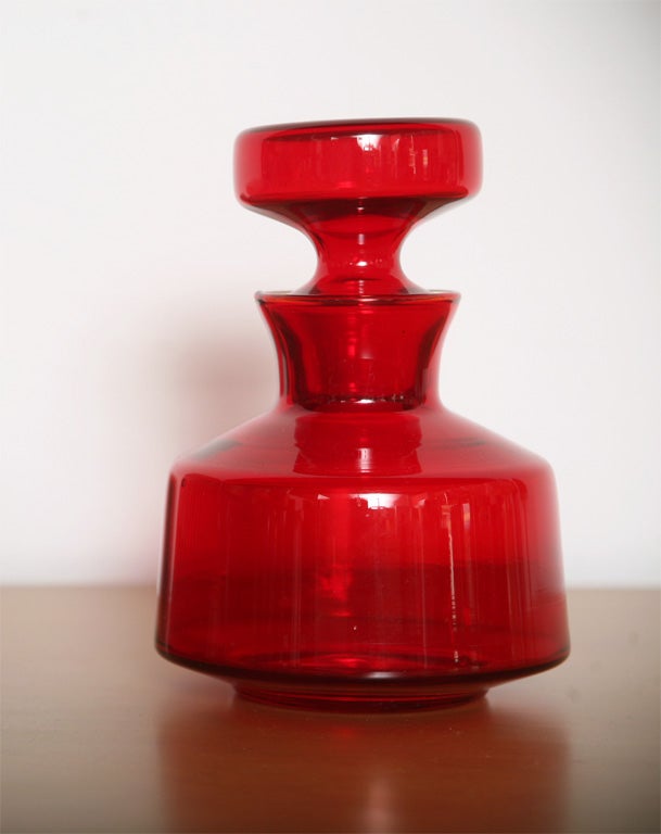 This ruby red 'bottle in glass' is a charming and delightful bottle with stopper