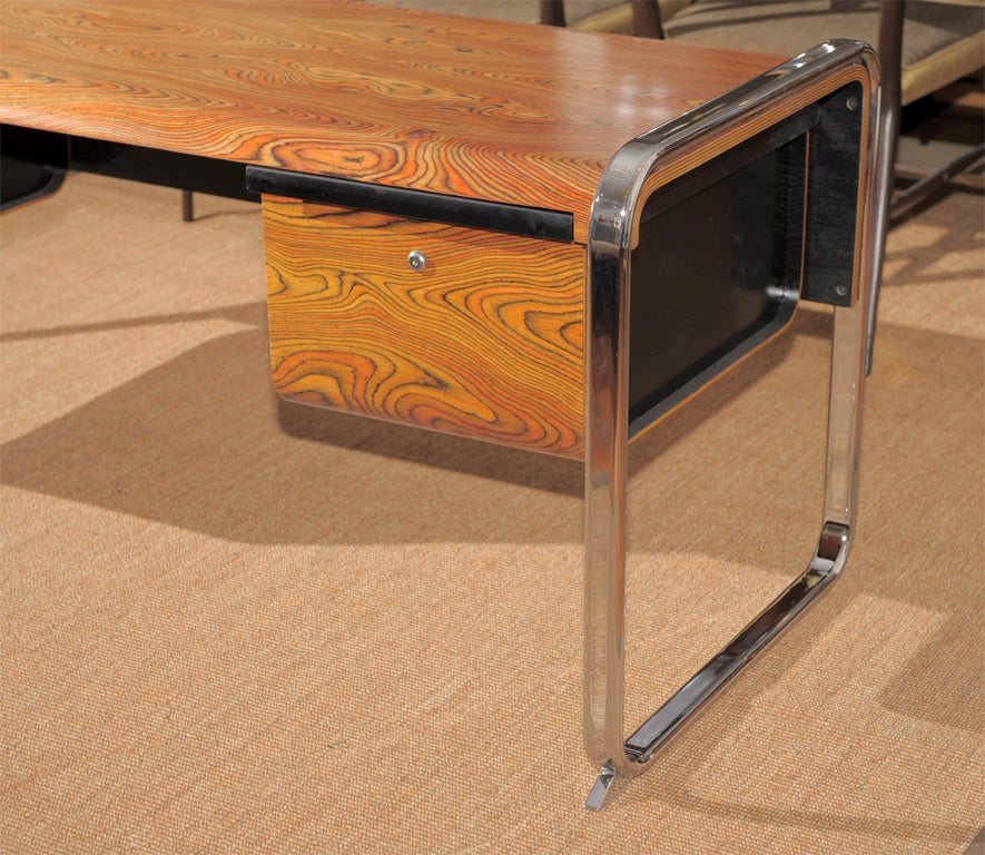 Exotic wood veneer and chrome desk deigned by Peter Protzman for Herman Miller. Completey refinished.