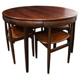 Rosewood Dining Table with Nested Chairs by Hans Olsen