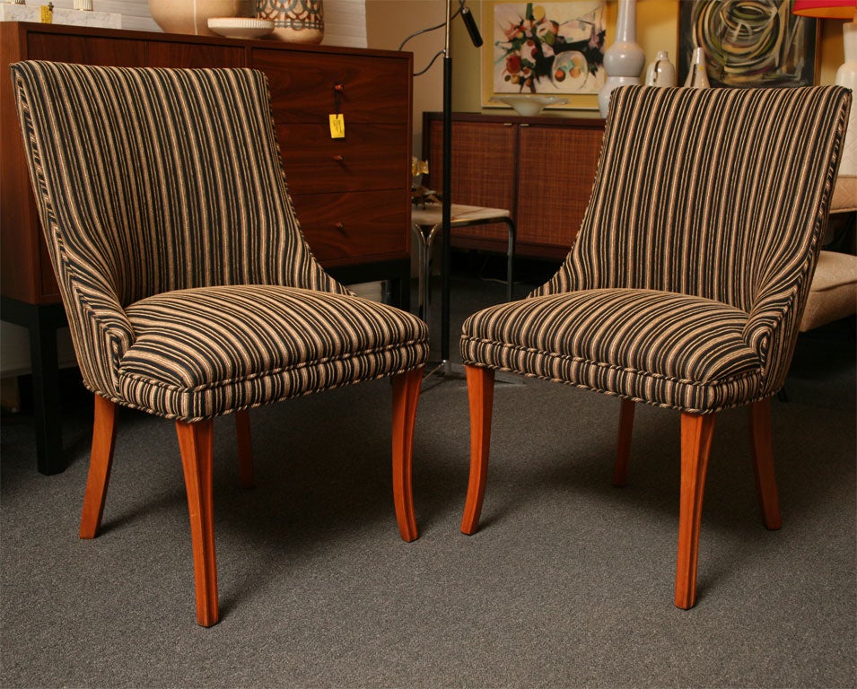 Elegant, sleek and handsome pair of 1940s slipper side chairs newly upholstered in woven striped chenille. Channel carved flaring front legs, beautiful shaped back and sloping cut-away arms. Great profile and comfy.

Reduced for saturday sale from