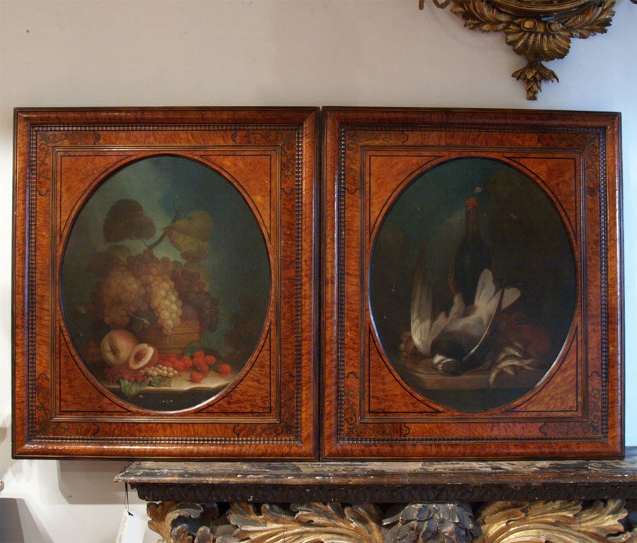 Pair of Nature Morte Oil on Canvas in Period Charles X frames of burl wood with brass inlay. Beautiful scenes, one of fruit and the other of game.