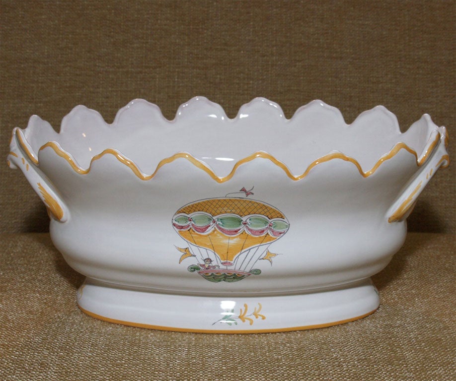 The balloon cooler is no longer available.  There is an identical cooler available with a decorative painted bouquet motif.  The cooler has been produced in Moustiers according to the standards of local crafts and traditions.  Biscuitware is cast,