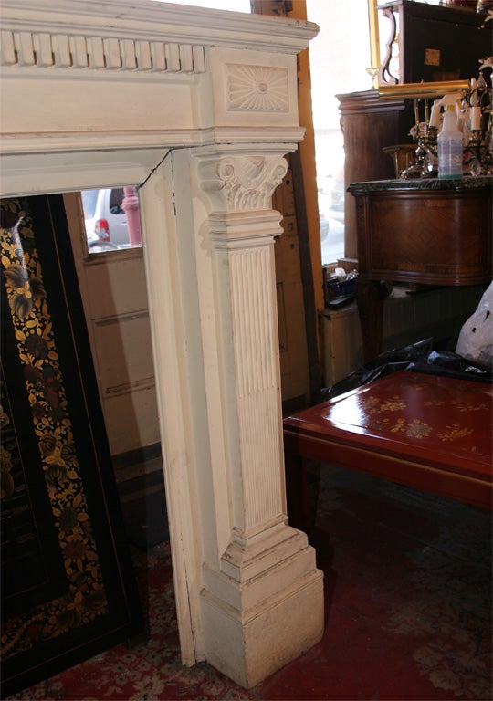 A very fine hand-carved antique mahogany fireplace in the federal manner.