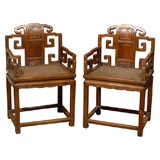 Pair of 19th Century Qing Dynasty Carved Chairs with a Cane Seat