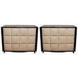 Pair of upholstered mahogany chests by Gilbert Rohde