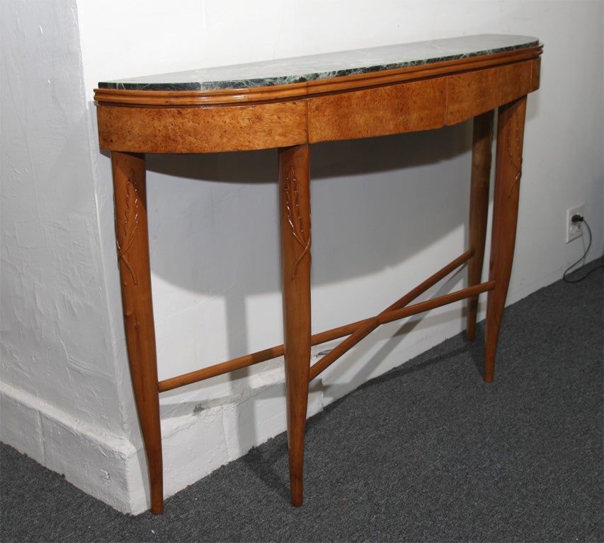 Beautiful unique art deco console designed by Giovanni Gariboldi and made by Quarti in Milan 1938-1940. Burl wood skirt with top in green marble each leg carved with an acanthus leaf, great quality.
 