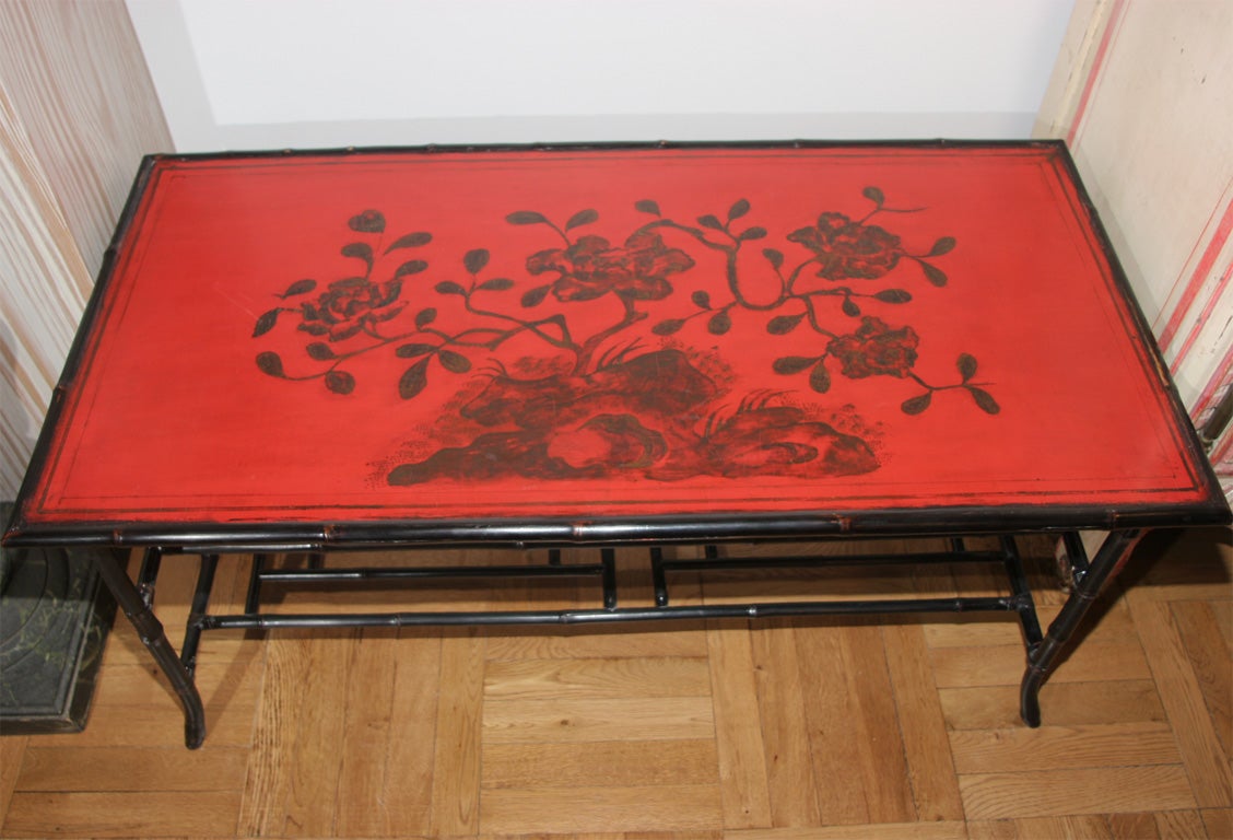 A Red Lacquer and Ebonized Bamboo Coffee Table