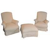 A Pair of Napoleon III Upholstered Lounge Chairs with Ottoman