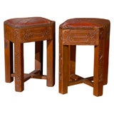 Carved bench/stool with red leather top