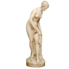 Sculpture in alabaster representing a bathing nymph