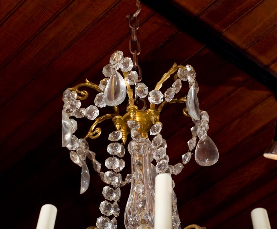 French Louis XVI  style gilt bronze and crystal  12 light chandelier For Sale