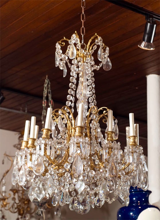 Bronze Louis XVI  style gilt bronze and crystal  12 light chandelier For Sale