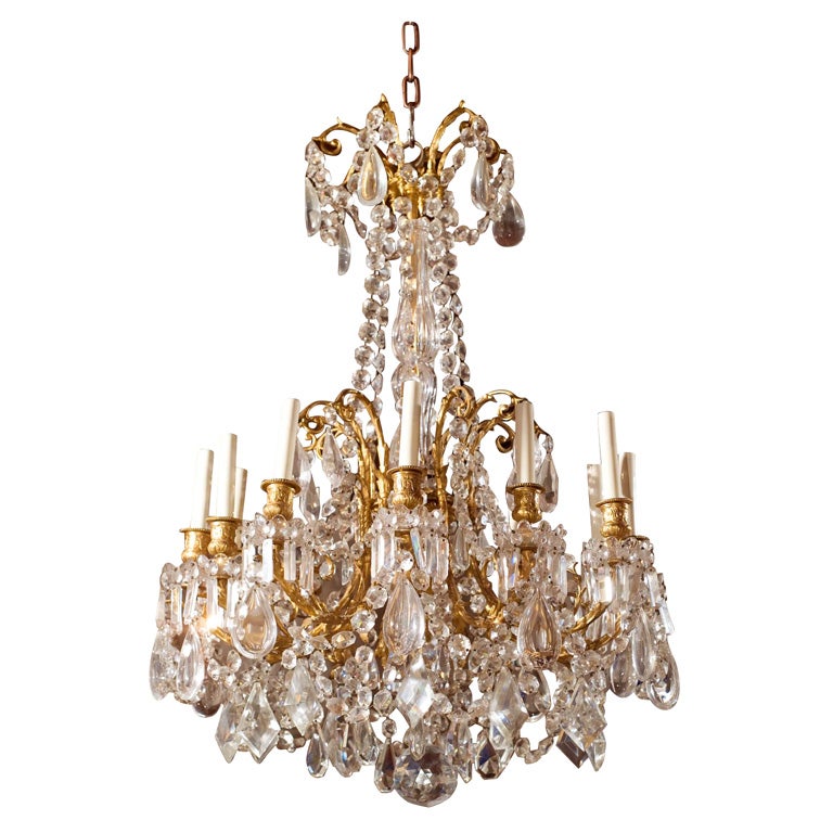Louis XVI  style gilt bronze and crystal  12 light chandelier For Sale