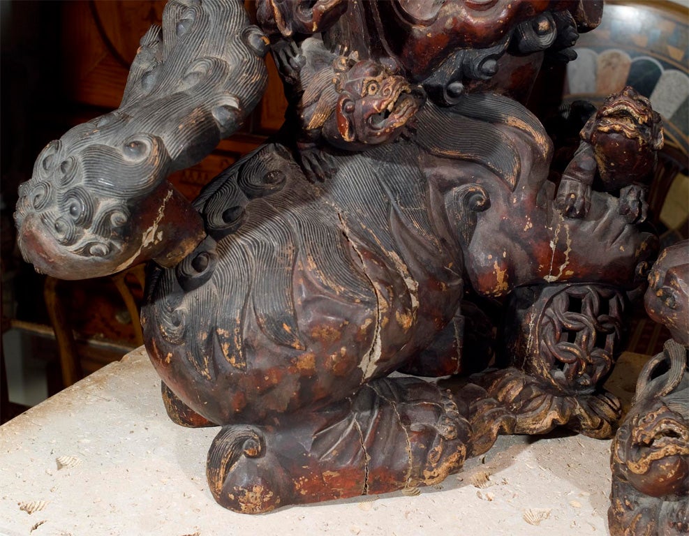 19th Century Pair lacquered, painted over gesso, carved wood Foo dogs