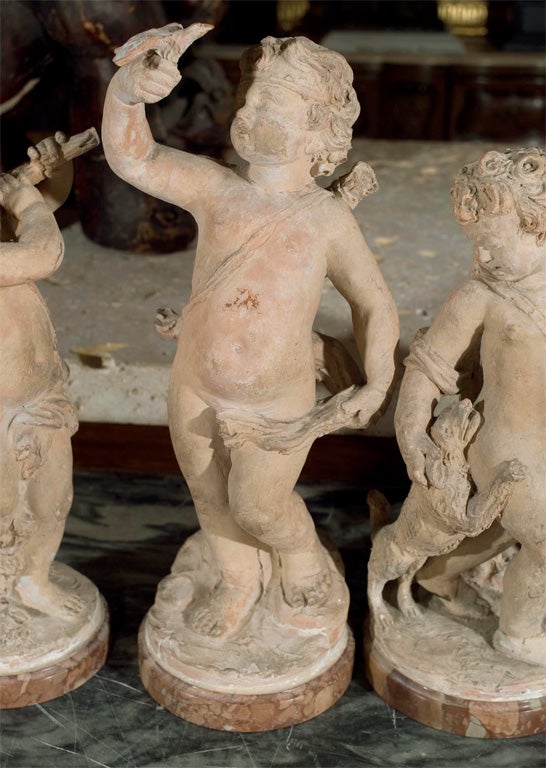 Folk Art a  group of French terracotta putti