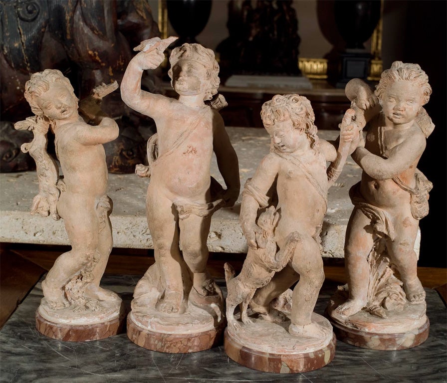 a  group of French terracotta putti 3