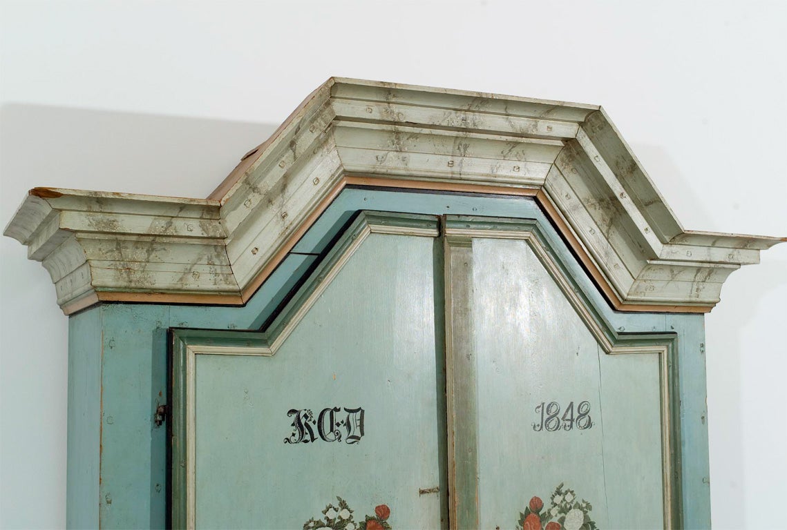 A Swedish  19th c. painted pine buffet deux corps, dated 1848,  from Jamtland, Sweden. This piece is notable for the use of several different  forms of Swedish faux paint finish used to charming collective effect.  The crown molding is painted in a