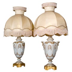Pair of Ornate White Ceramic Hollywood Regency Style Lamps on Bronze Base