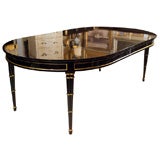 STAMPED JANSEN EBONIZED TWO LEAF DINING TABLE