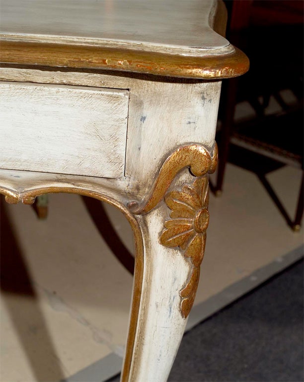 Beautiful French Louis XV Style distressed, white painted with gold hi-lights desk. Drawers on both sides; stamped Jansen. Finely Detailed.