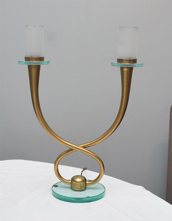 A Fontana Arte brass twisted candlestick lamp with a glass base. Re-wired.