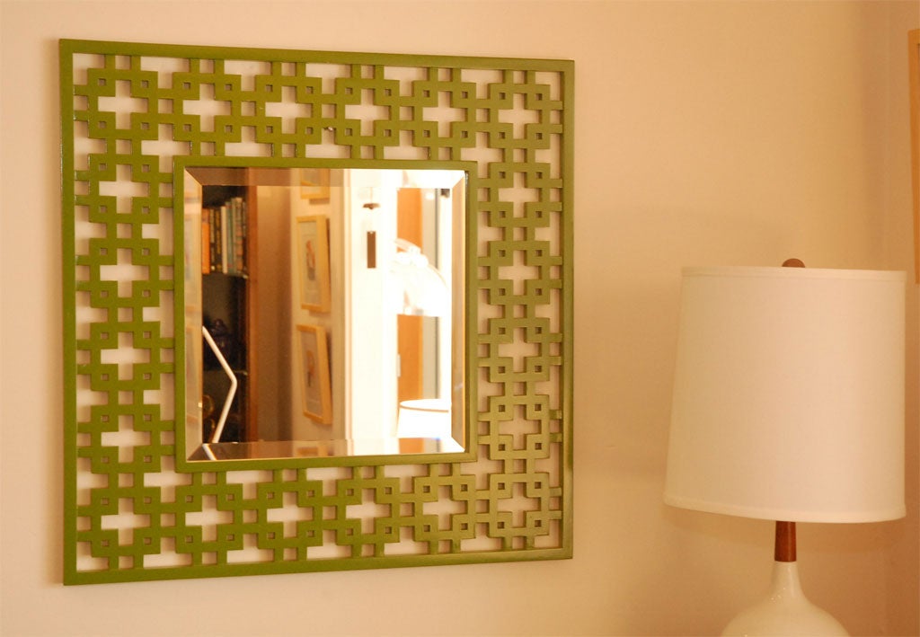 Bright green hand carved mirror.