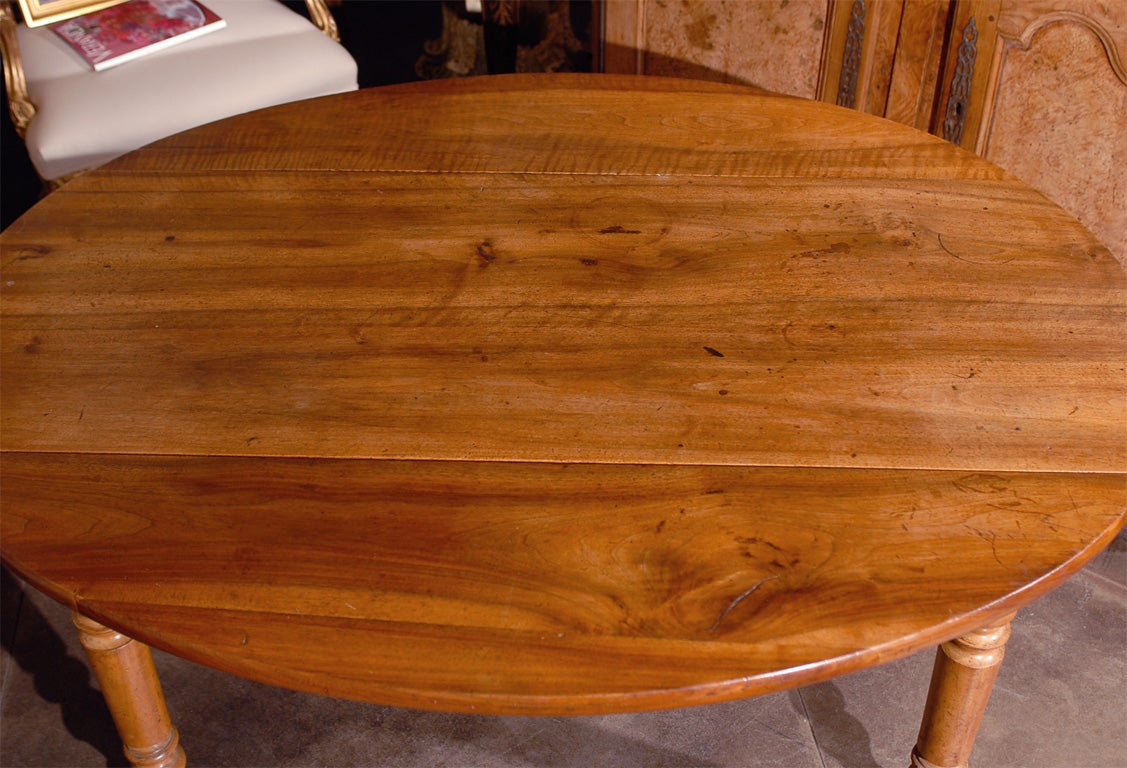 Turned French Oval Drop Leaf Walnut Farm Table with Drawer from the 1870s