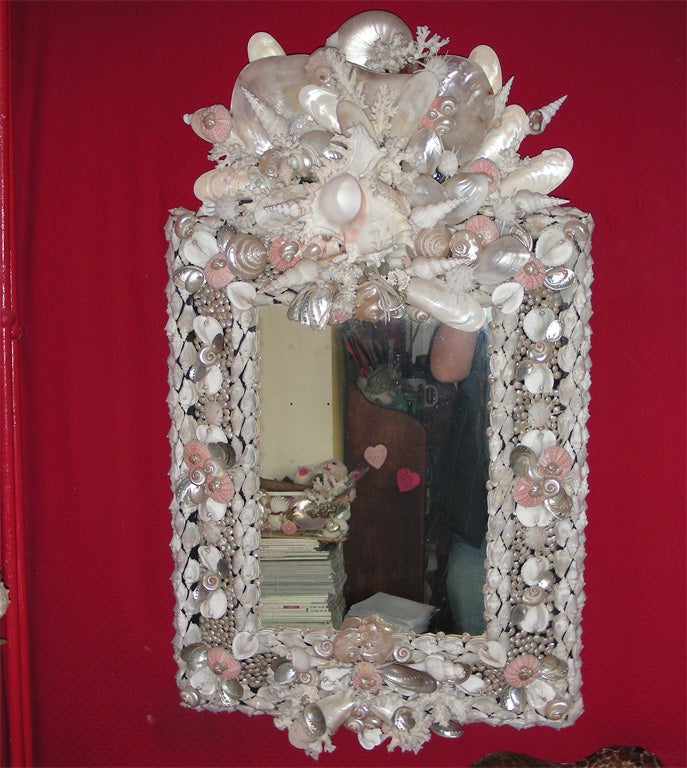 Venetian mirror framed by Frédérique Lombard Morel with an assemblage of multicolored shells.