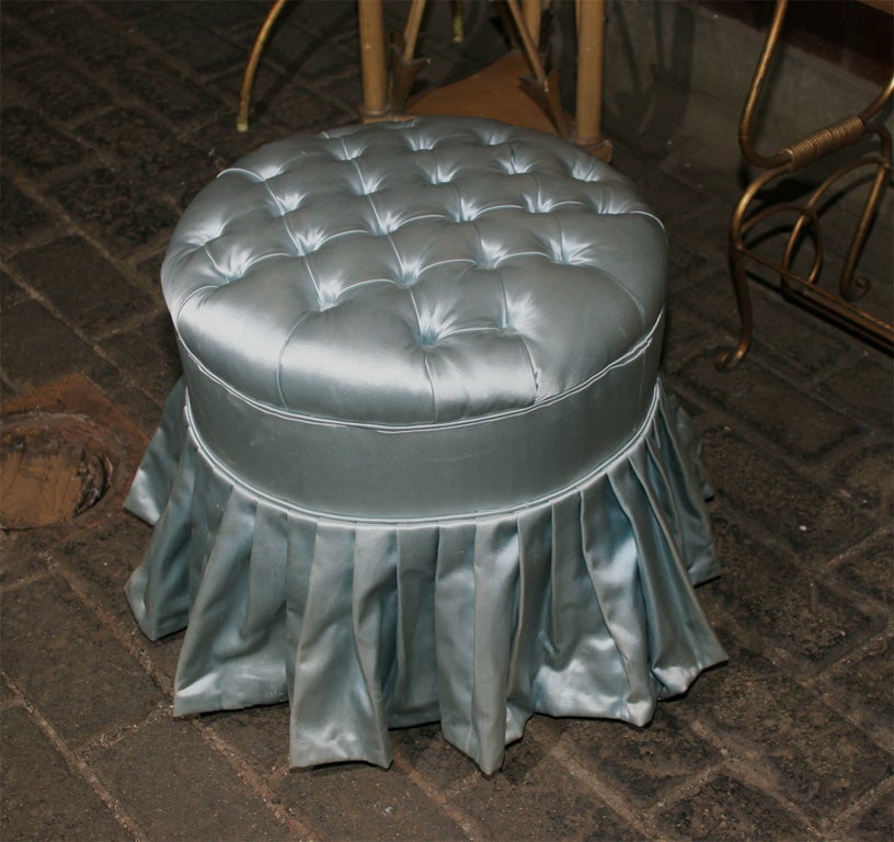 Pale blue satin round tufted pouf from a French boudoir.