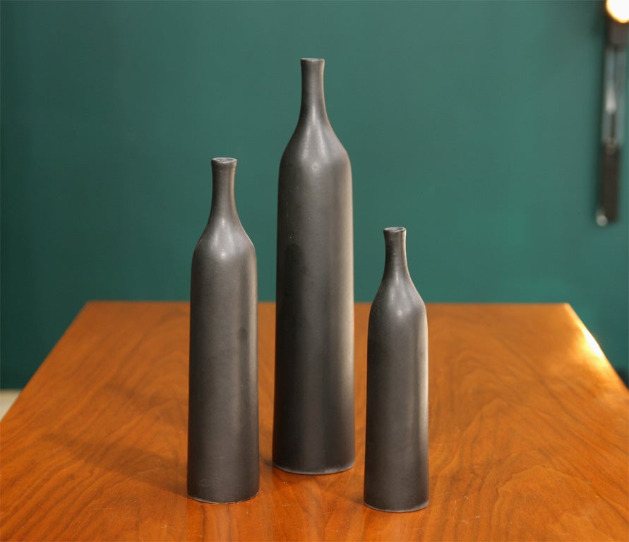 Group of bottle-form ceramic vases in an uncharacteristic dark grey glaze. By Jacques and Dani Ruelland, French 1950.  We have around thirty others in different colors and forms.<br />
Tallest: 11