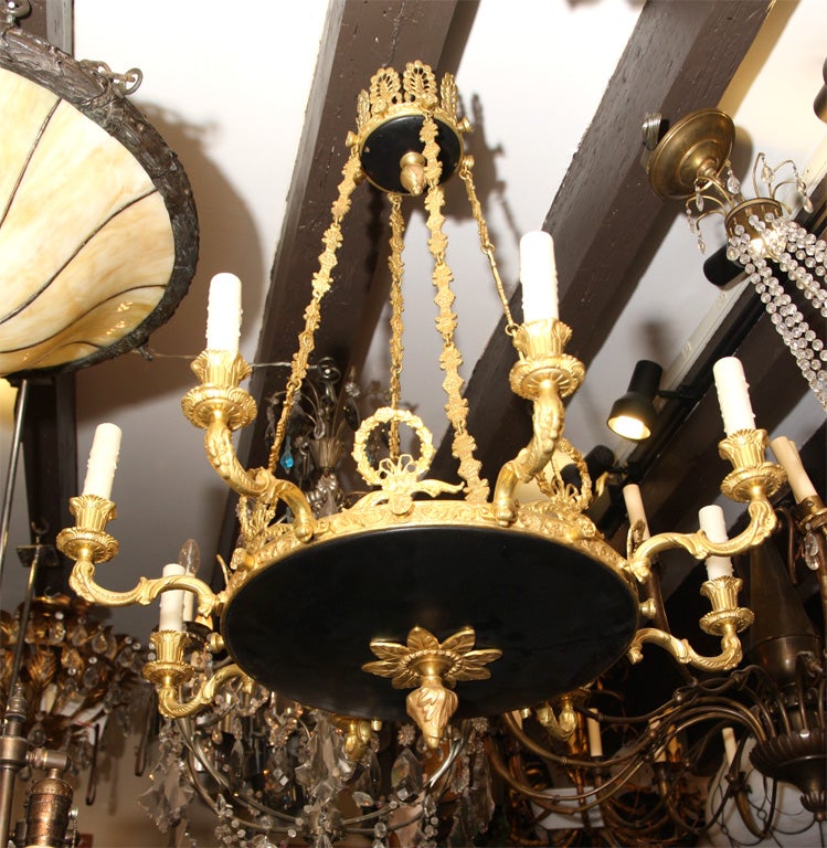 A circa 1920s French Empire-style eight-arm chandelier.
Measurements:
Diameter: 28