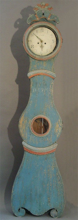 Swedish Mora clock dated 1858 in original blue and salmon paint and with a carved 