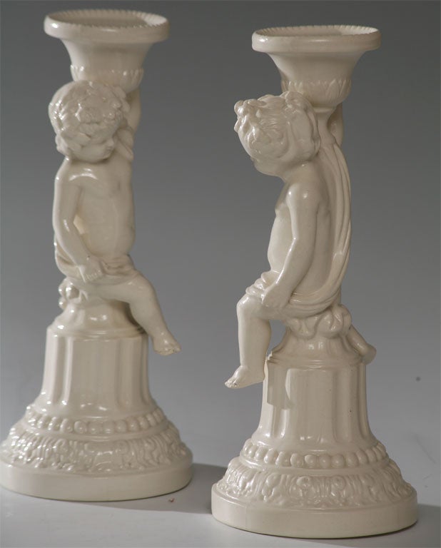 Porcelain Pair of Minton Salt-Glazed Figural Candlesticks For Sale