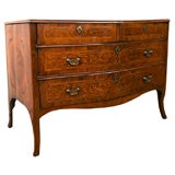A Neoclassical Four Drawer Mahogany and Fruitwood Commode