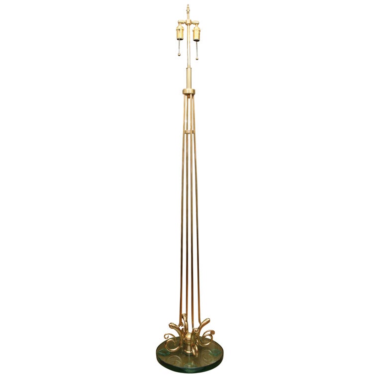 Singlebrass rod floor lamp with green glass base