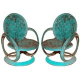 Pair of indoor/outdoor rubber tire radial green chairs