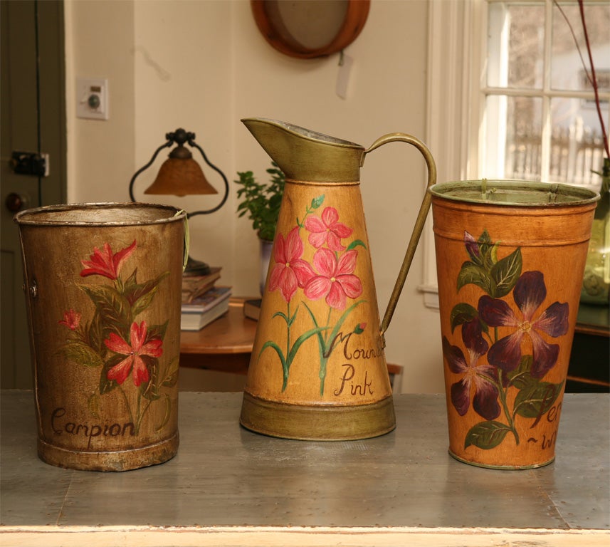 These three pieces are original, but has had a new floral design painted on them , by our English antique dealers wife. these would be wonderful as a vase and since the images were shot the darker piece on the left hand side of the principal image