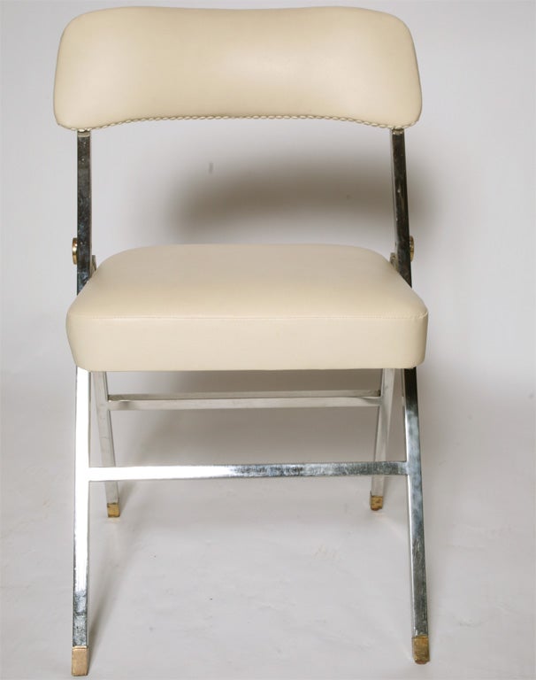 set of 6  Folding Chairs

Steel ,Brass and Naugahyde