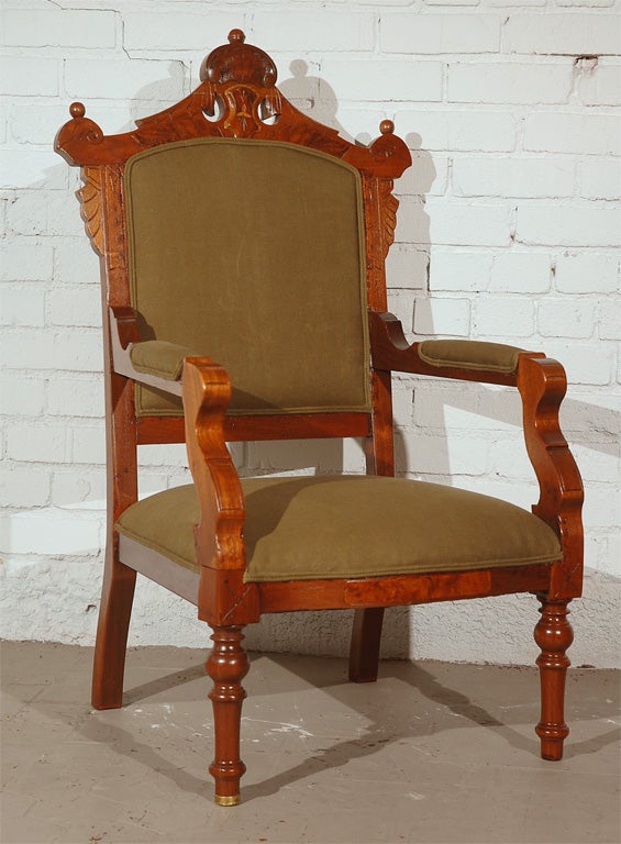 Carved solid walnut English open-arm chair. Gorgeous turned wood legs with one original brass cap on the leg. Unique raised relief carvings and hand-notched styling throughout.  Expertly reupholstered in a vintage Swedish military tent fabric.