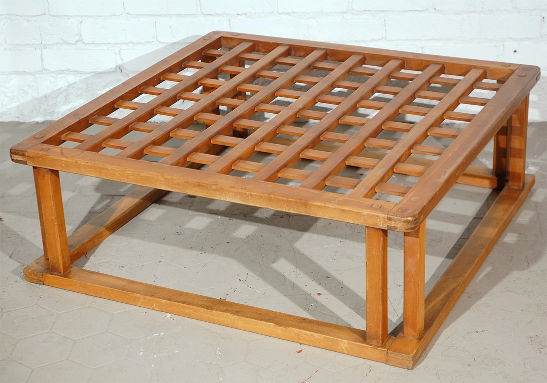 A Vintage 1950's Japanese Habachi Style Wood Coffee Table with Glass tempered top. Very interesting piece and the glass could be taken off and turned into an ottoman. Place some amazing cushions on it and you've got an extra seating area.