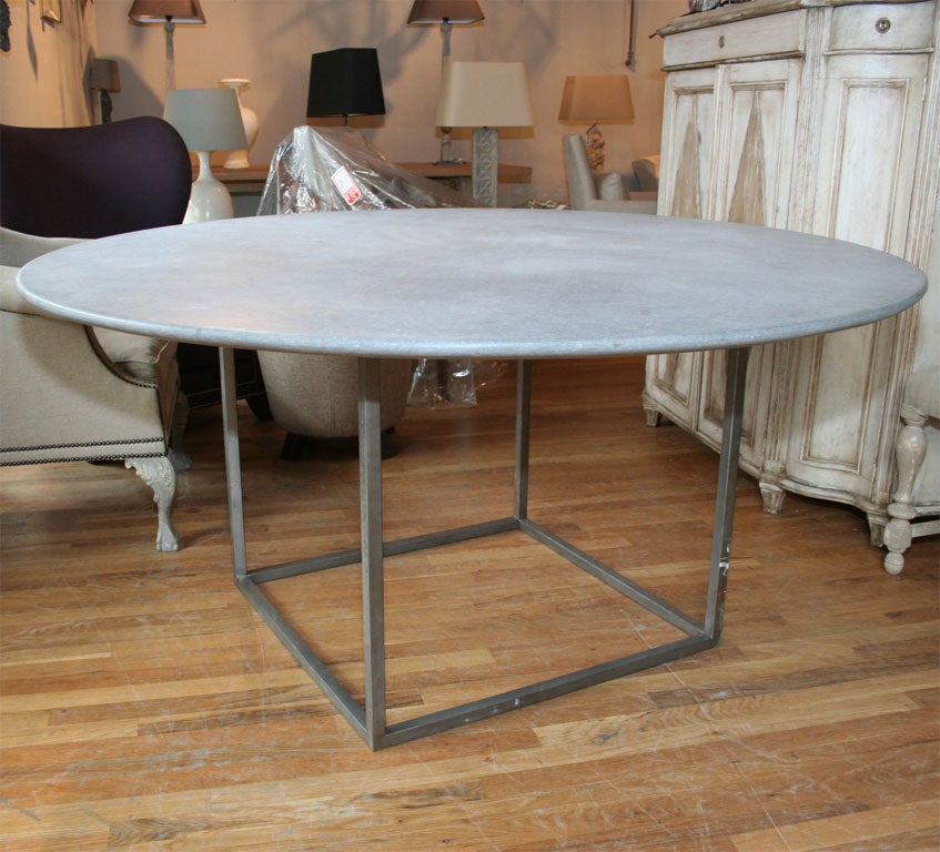 Iron base table with round bluestone top. Can be made to any size.