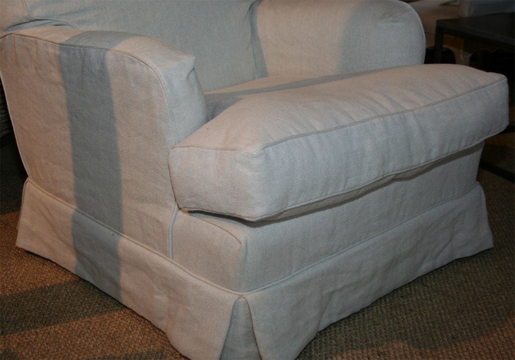 Comfortable club chair slipcovered in natural linen. Can be made in any fabric.