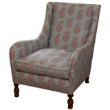 Unusual armchair newly reupholstered in paisley fabric