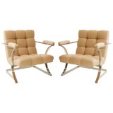 A Pair of Chrome and Biscuit-Tufted Arm Chairs