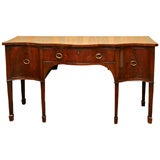 ENGLISH, GEORGE III. MAHOGANY SERPENTINE FRONT SIDEBOARD