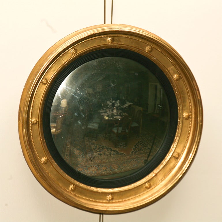 English, gold leaf girandole mirror Ca. 1840 with reeded black liner and stair <br />
decoration