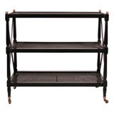 A Directoire Style Ebonized and Caned Three Tier Stand by Jansen