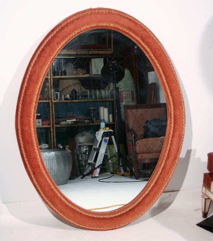 A Napoleon III Oval Mirror with Original Velvet Frame