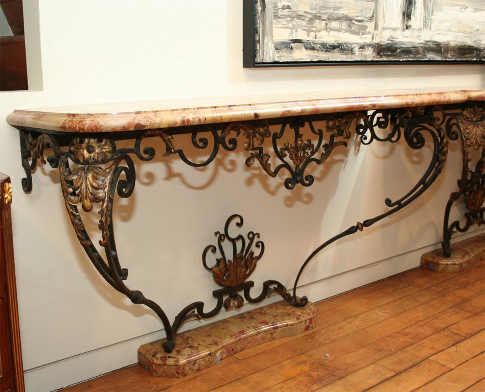 A Fine Pair Louis XV Style Iron and Breche d'Alep Consoles