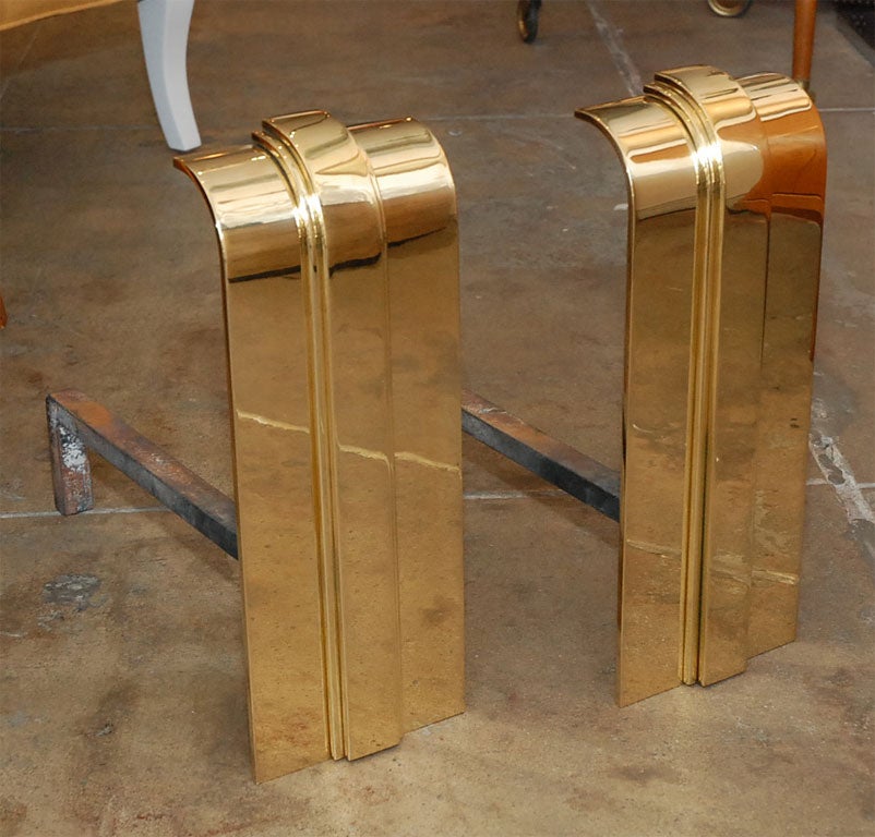 Pair of Art Deco style Brass andirons by Karl Springer.